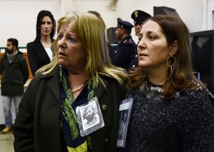 Relatives react to the sentence read by the judges of the Third Court of Rome during the trial of South American military officers and civilians accused of collaborating in the forced disappearances and murder of Italian nationals, in a US-backed regional plan dubbed "Operation Condor ", from the maximum security room of the Rebibbia prison in Rome on January 17, 2017.  Italian justice will rule today in the trial of 34 South American military officers and civilians accused of collaborating in the forced disappearances and murder of more than 40 political opponents, including Italian nationals, as part of a US-backed regional plan dubbed "Operation Condor" during the dictatorships of the Southern Cone in the 1970s and 1980s.    / AFP PHOTO / FILIPPO MONTEFORTE