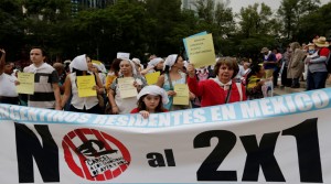 The Argentinian community in Mexico hold a banner during a demonstration in Mexico City